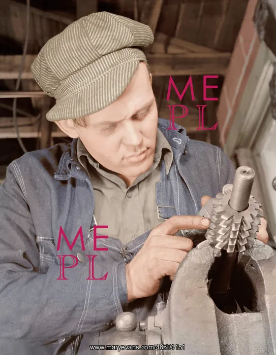 : Man working in a small machine shop for war : Man working in a small machine shop for war