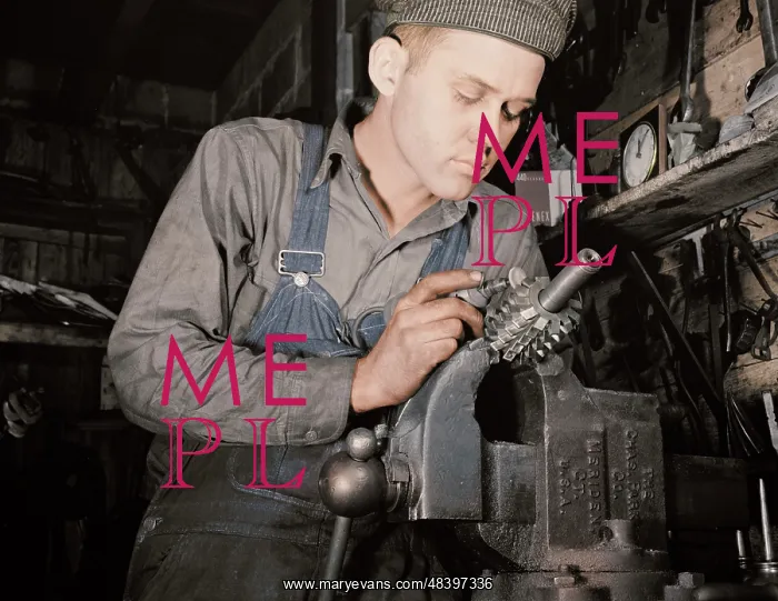 : Man working in a small machine shop for war : Man working in a small machine shop for war