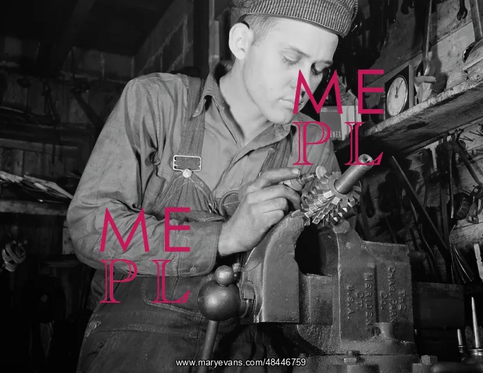 : Man working in a small machine shop for war : Man working in a small machine shop for war