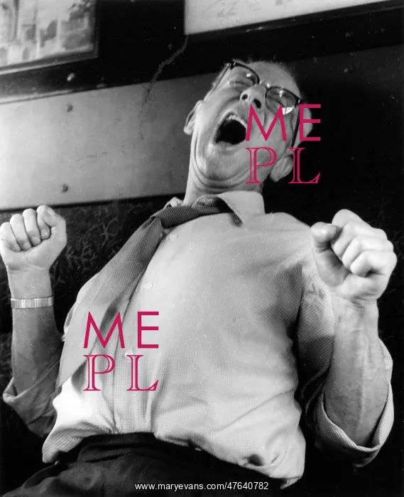 : Man yawning and stretching on a train : Man yawning and stretching on a train