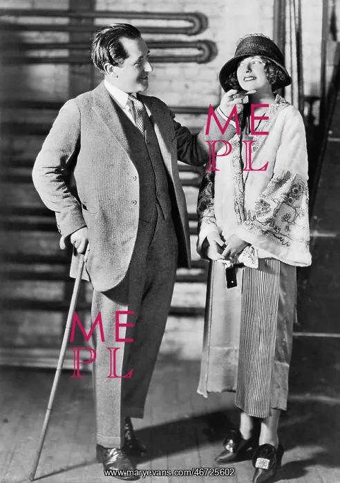 : Man and a young woman in a hat looking at each other : Man and a young woman in a hat looking at each other