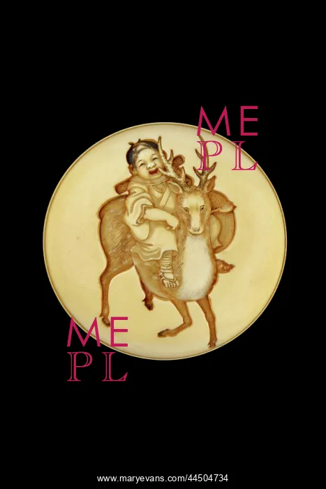 : Manju netsuke - a child riding a sacred deer : Manju netsuke - a child riding a sacred deer
