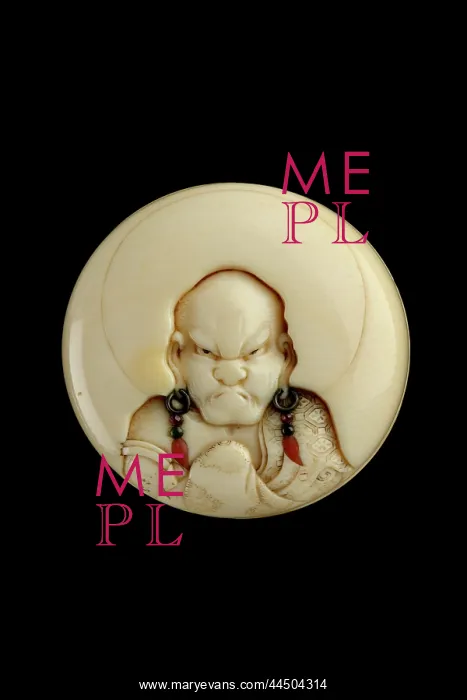 : Manju netsuke with a head and shoulders portrait of a rakan : Manju netsuke with a head and shoulders portrait of a rakan