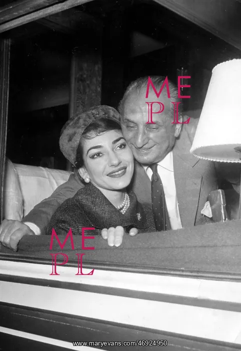 : Maria Callas, opera singer, with husband on a train : Maria Callas, opera singer, with husband on a train
