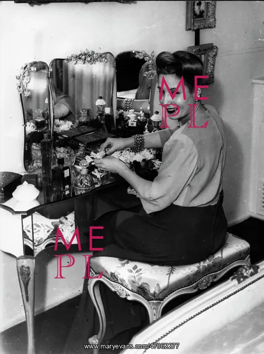 : Maria Eva Duarte de Peron at her dressing table : Maria Eva Duarte de Peron at her dressing table