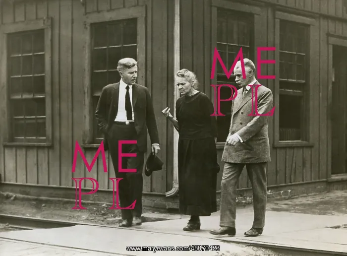 : Marie Curie walking with fellow scientists : Marie Curie walking with fellow scientists