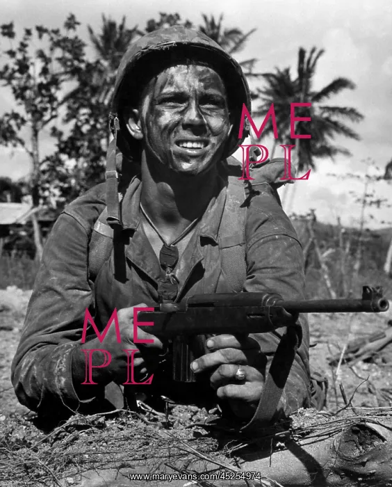 : A Marine awaits the signal to go into battle to : A Marine awaits the signal to go into battle to