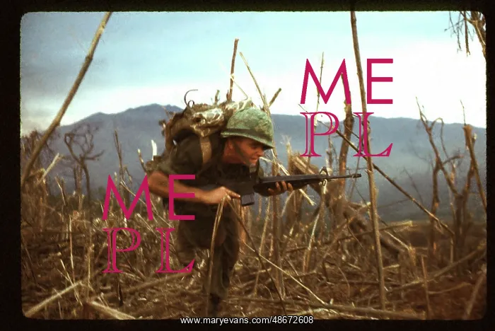 : A Marine, under fire, runs for cover near the : A Marine, under fire, runs for cover near the