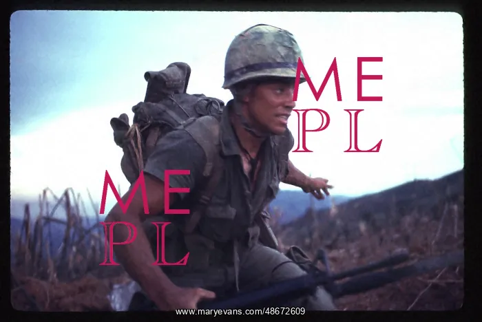 : A Marine, under fire, runs for cover near the : A Marine, under fire, runs for cover near the