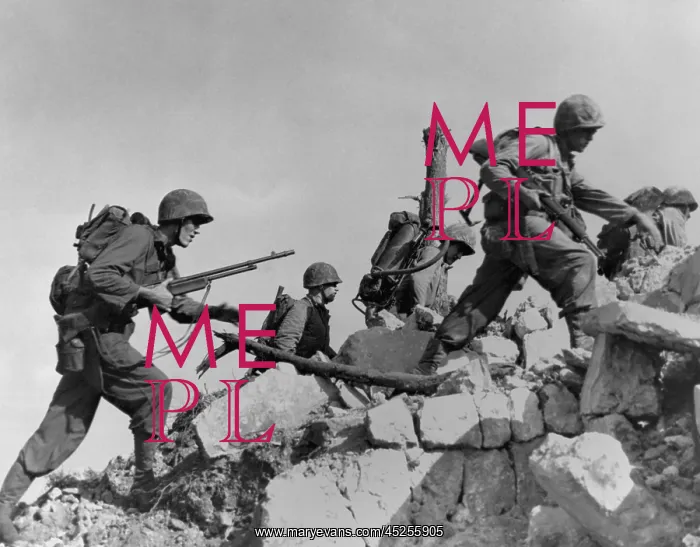 : Marines hurdle a stone wall as they arrive in : Marines hurdle a stone wall as they arrive in