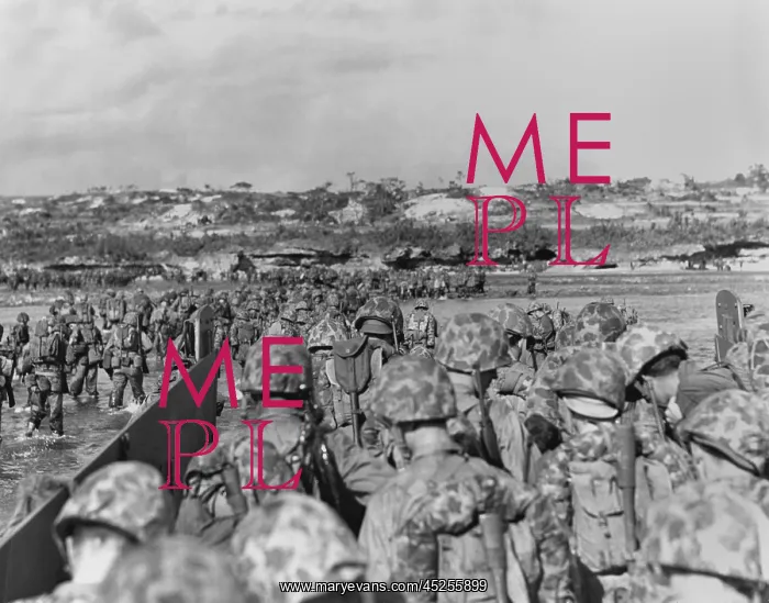 : Marines leave their landing craft to wade over : Marines leave their landing craft to wade over