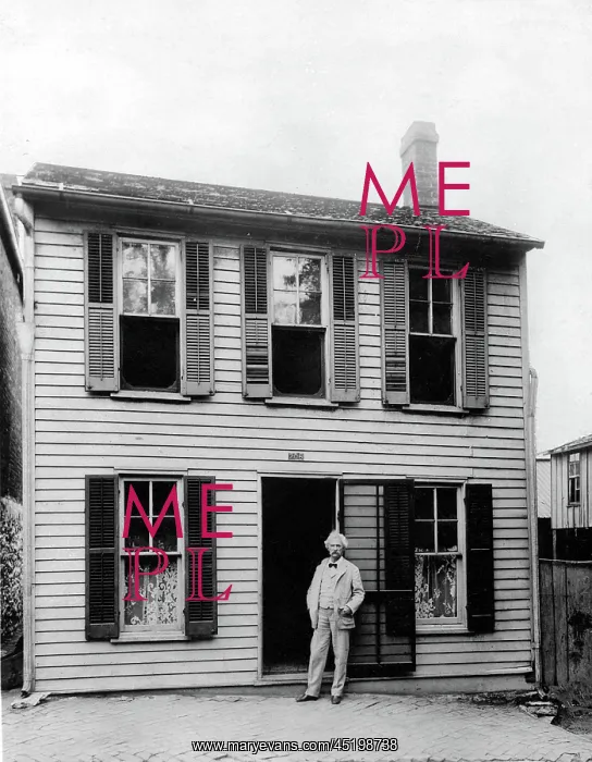 : MARK TWAIN in front of his boyhood home ? : MARK TWAIN in front of his boyhood home ?