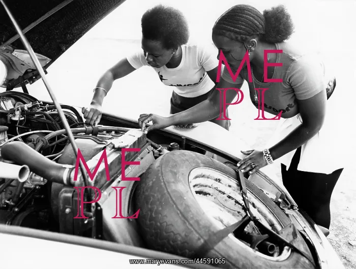 : Mary Orie Rogo and Pamela Anyango checking their : Mary Orie Rogo and Pamela Anyango checking their