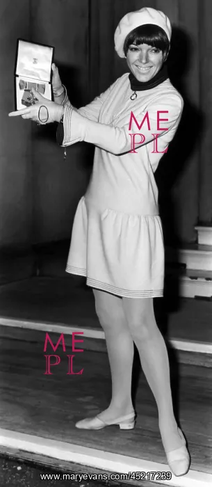 : Mary Quant holding her Order of the British Empire medal : Mary Quant holding her Order of the British Empire medal