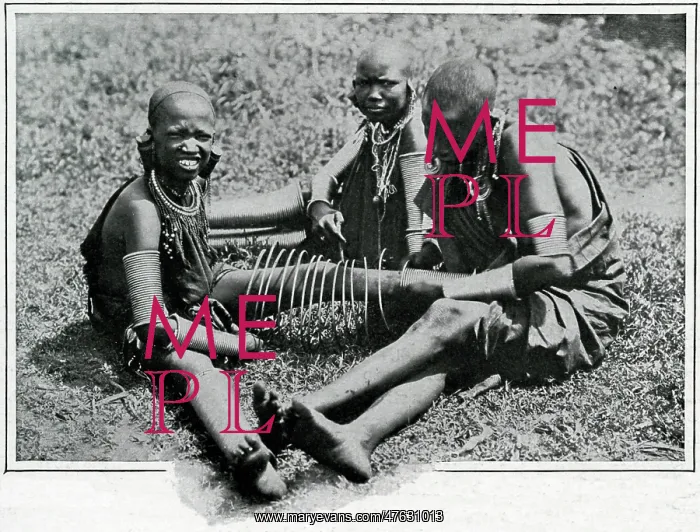 : Masai young women adjusting iron wire : Masai young women adjusting iron wire