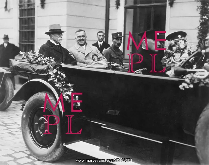 : Masaryk riding convertible car driven by his personal : Masaryk riding convertible car driven by his personal