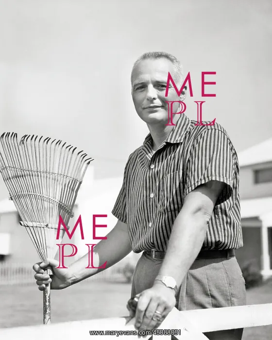 : Mature Man Holding a Bamboo Rake : Mature Man Holding a Bamboo Rake