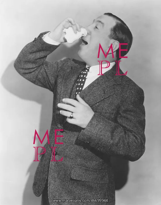 : Mature man in suit sneezing : Mature man in suit sneezing