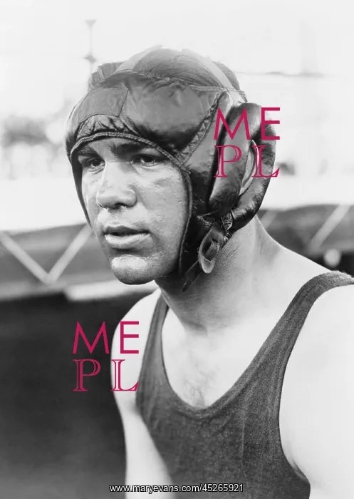 : Max Schmeling, wearing protective helmet, and : Max Schmeling, wearing protective helmet, and