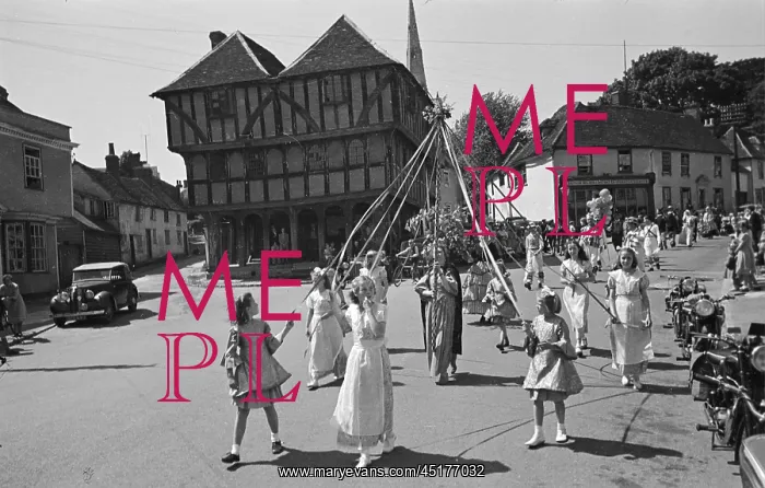 : May Pole. Young girls dancing around a May pole in front of the Guild Hall, Thaxted : May Pole. Young girls dancing around a May pole in front of the Guild Hall, Thaxted