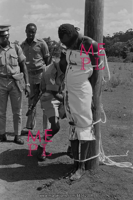 : MBALE, UGANDA - FEBRUARY - A crowd of twenty-thousand : MBALE, UGANDA - FEBRUARY - A crowd of twenty-thousand