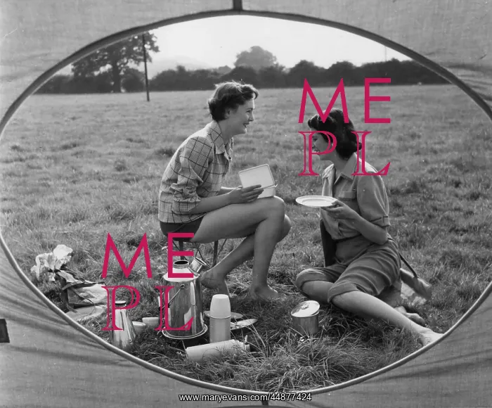 : MEAL TIME. Two women enjoying a meal- whatever is in that box must be very tasty : MEAL TIME. Two women enjoying a meal- whatever is in that box must be very tasty