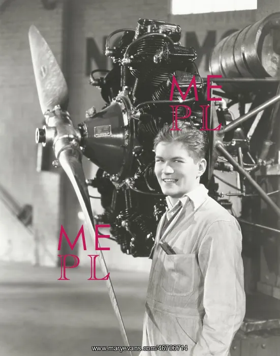  : Mechanic standing next to propeller