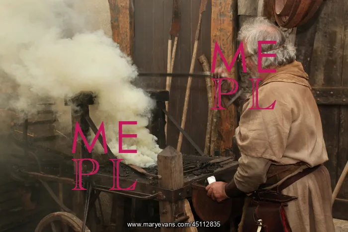 : Medieval blacksmith at work : Medieval blacksmith at work