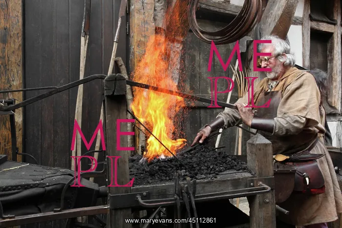 : Medieval blacksmith at work : Medieval blacksmith at work
