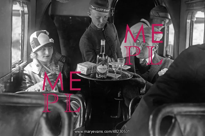 : A member of the Lufthansa air crew with passengers, 1926 : A member of the Lufthansa air crew with passengers, 1926