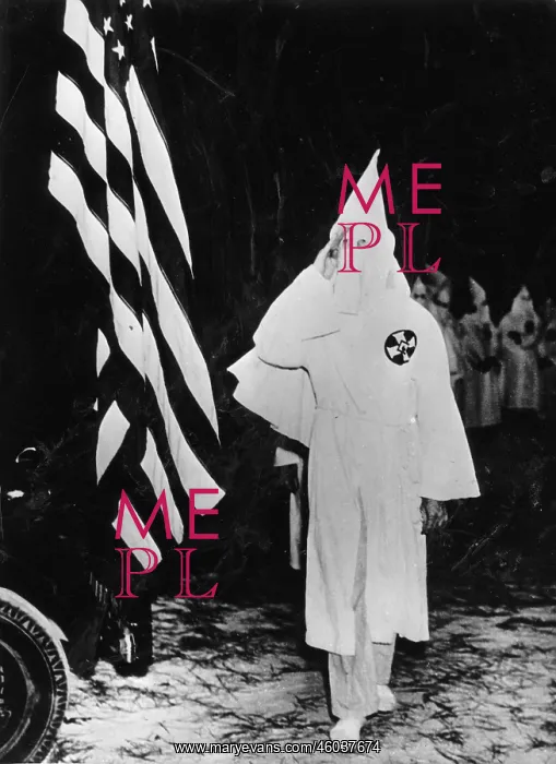 : Members of the Ku Klux Klan saluting : Members of the Ku Klux Klan saluting