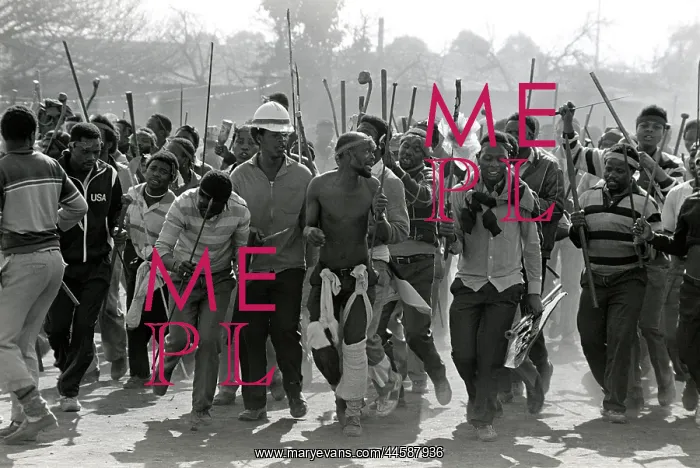 : Men, armed with traditional weapons, and some : Men, armed with traditional weapons, and some