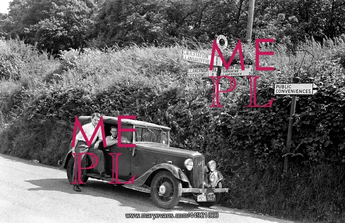 : Two men with Austin car : Two men with Austin car