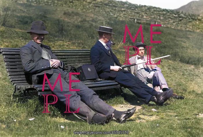 : Three men on a bench in the countryside : Three men on a bench in the countryside