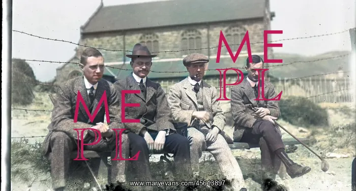 : Four men on a bench at golf club : Four men on a bench at golf club