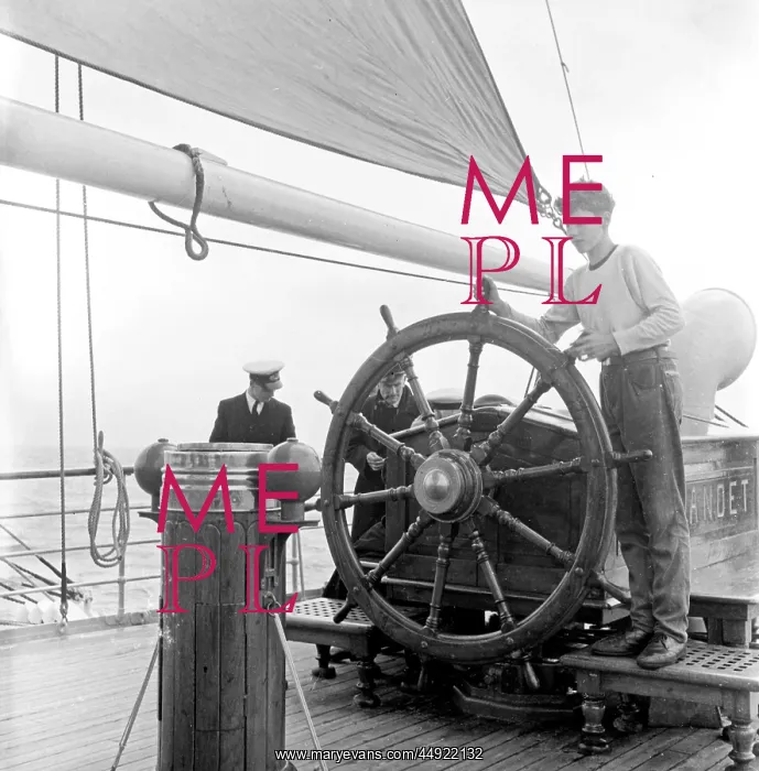 : Men and boy on deck of ship : Men and boy on deck of ship