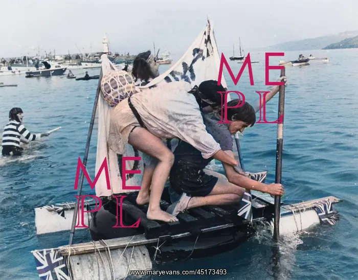 : Two men competing in a raft race, St Ives, Cornwall : Two men competing in a raft race, St Ives, Cornwall
