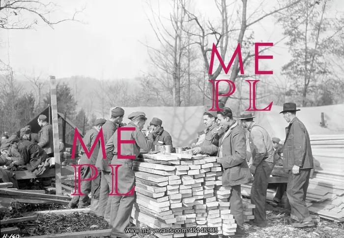 : Men eating outdoors at a Civilian Conservation : Men eating outdoors at a Civilian Conservation