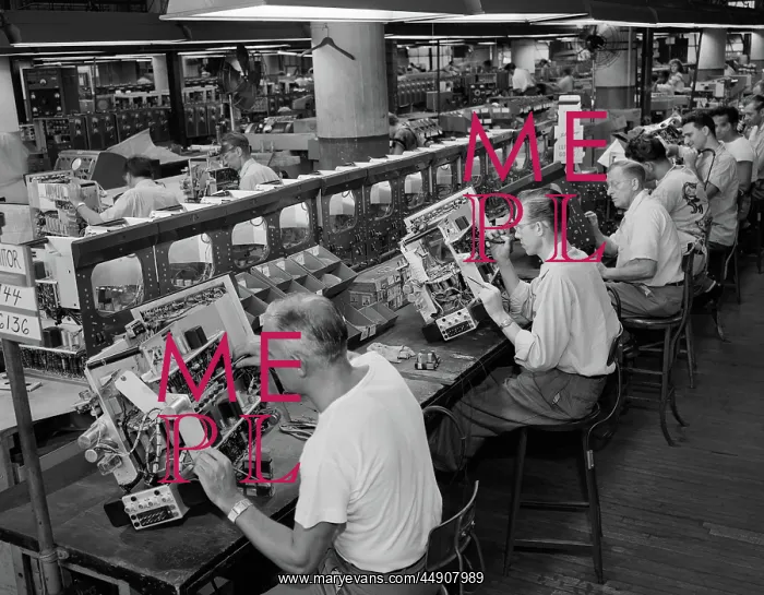: Men in electronics factory working on television : Men in electronics factory working on television