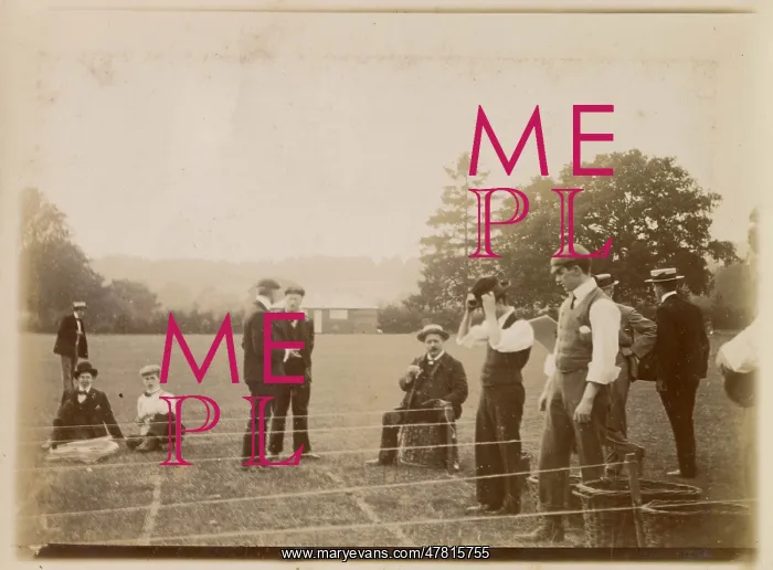 : Men engaged in sporting activity in a field : Men engaged in sporting activity in a field