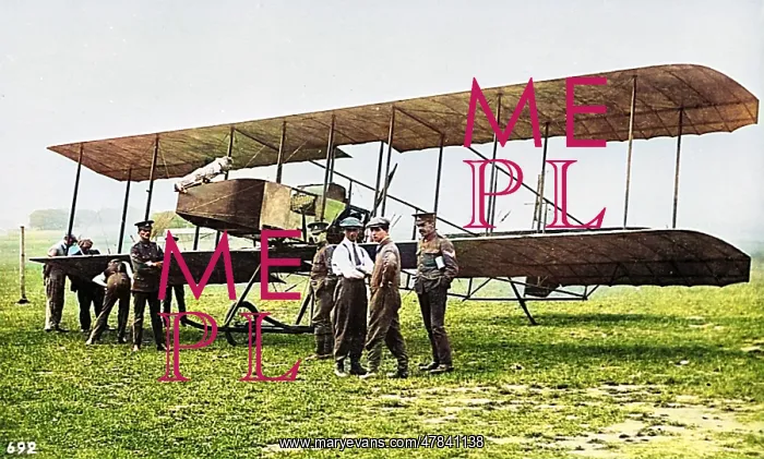  : Men in a field with an early biplane