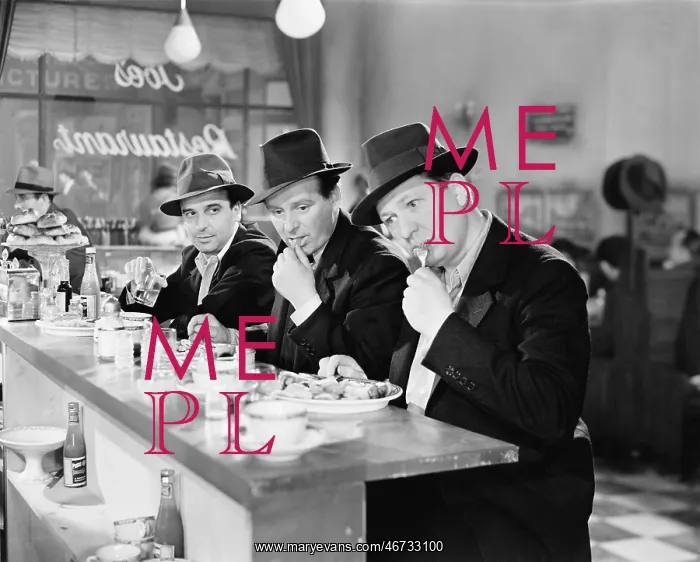 : Three men with hats eating at the counter of a diner : Three men with hats eating at the counter of a diner