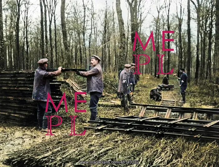 : Men laying new light railway, Western Front, WW1 : Men laying new light railway, Western Front, WW1
