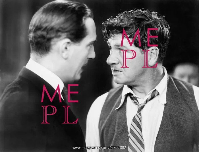 : Two men looking angrily at each other : Two men looking angrily at each other