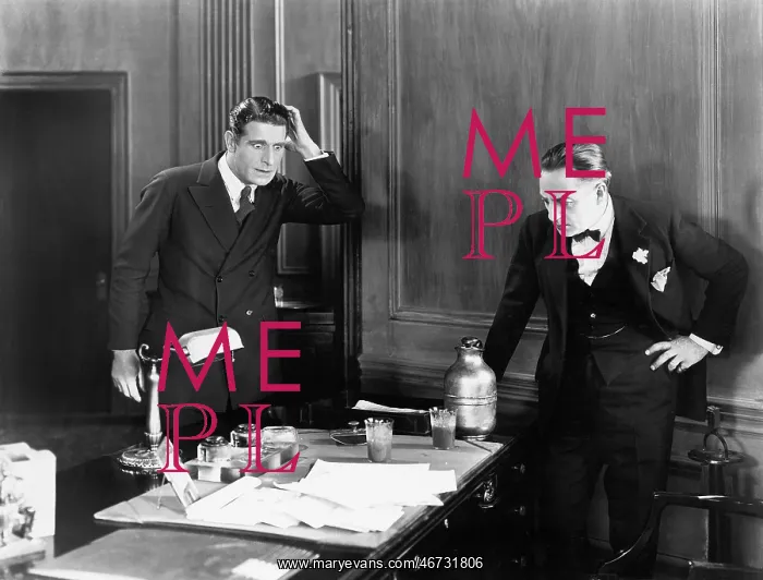 : Two men looking surprised in an office : Two men looking surprised in an office