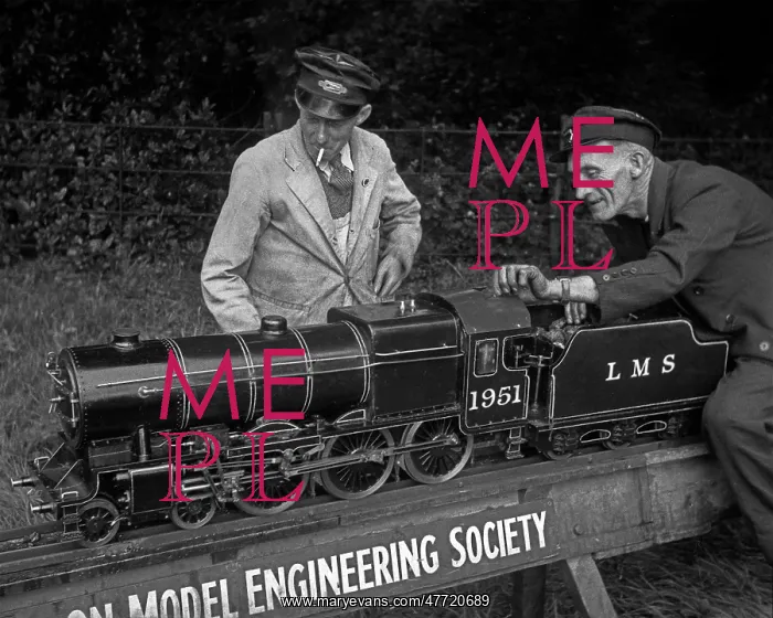 : Men with model working steam engine : Men with model working steam engine