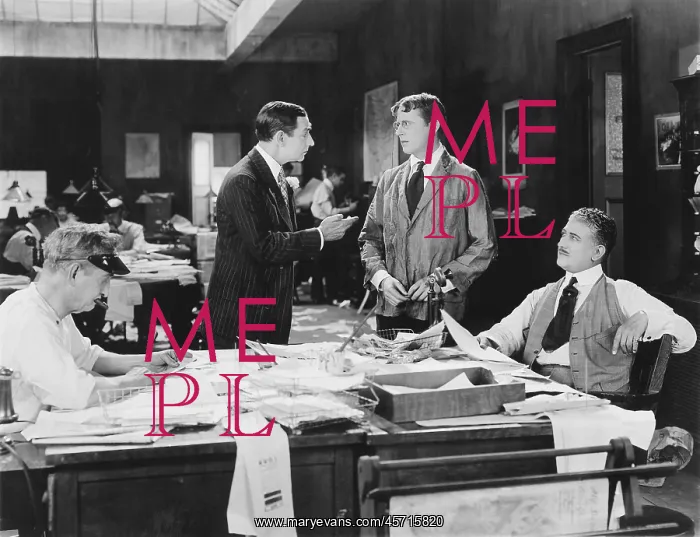 : Four men at an office : Four men at an office