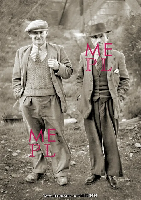 : Two men in an outdoor setting : Two men in an outdoor setting