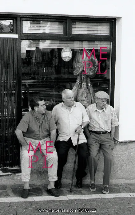 : Three men outside shop, Spain : Three men outside shop, Spain