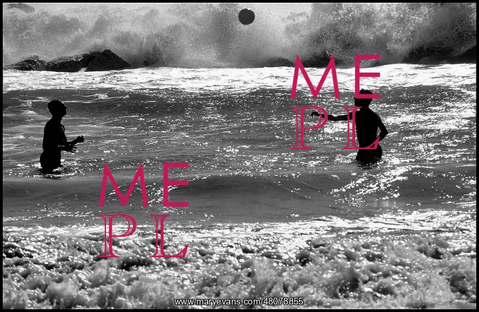  : Men playing with a ball in heavy surf